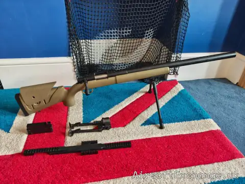 Tan spring-powered bolt-action airsoft sniper rifle, marked APM40A3 / SR12 F 001669